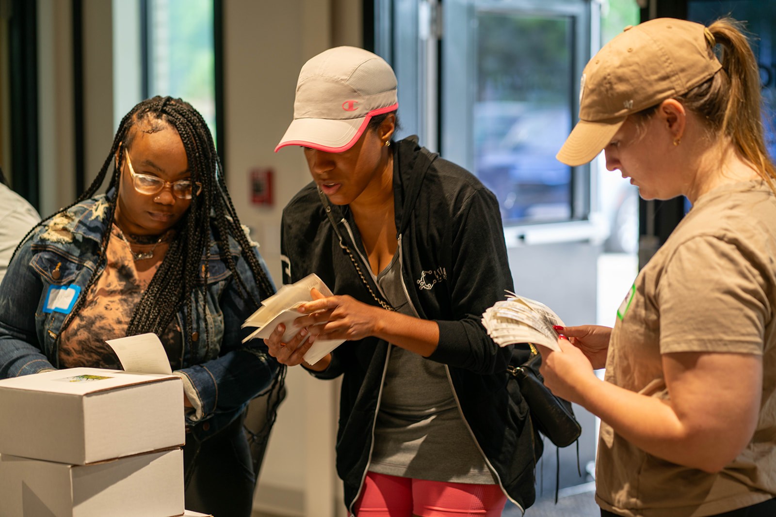Volunteers packing care kits and sorting supplies for neighbors
